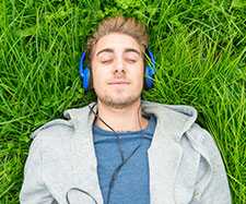 male is listening to music on his headphones male is listening to music on his headphones