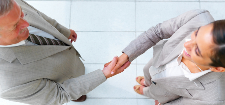 coworkers shaking hands