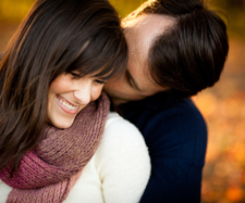 man intimately holding woman