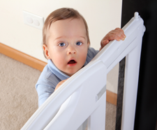 child holding onto the bed