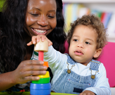 toddler playing with a toy