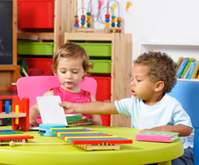 two children playing together in child care